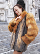 Fox-fur style jacket with orange-brown and gray panels, wide sleeves, and plush collar.