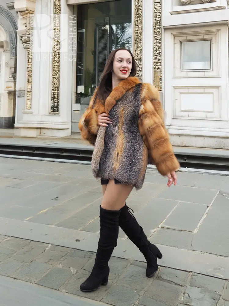 Fur jacket with orange and grey diamond panels and big, rounded collar.