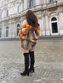 Two-tone fox fur jacket with orange-red shoulders and grey midsection, full sleeves