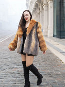 Front view of orange-and-grey fur jacket with oversized collar and plaid pattern.