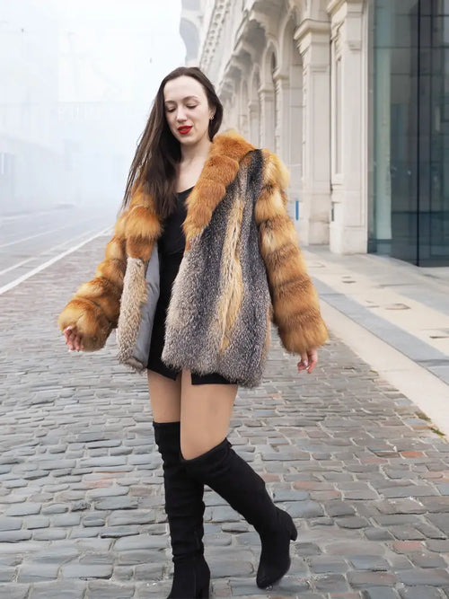 Front view of orange-and-grey fur jacket with oversized collar and plaid pattern.