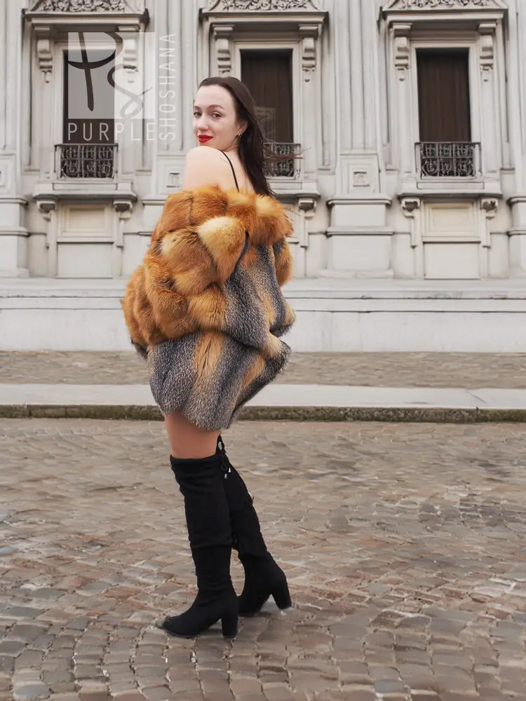 Fox-fur style jacket with orange-brown outer fur and gray paneling, side view with boots.