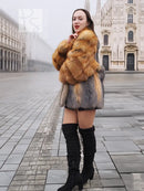 Fox-fur style jacket in orange-brown and gray with plush collar, worn with tall black boots.