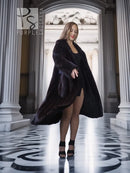 Black mink full-length coat with V-neck and side-slit hem, wide sleeves.