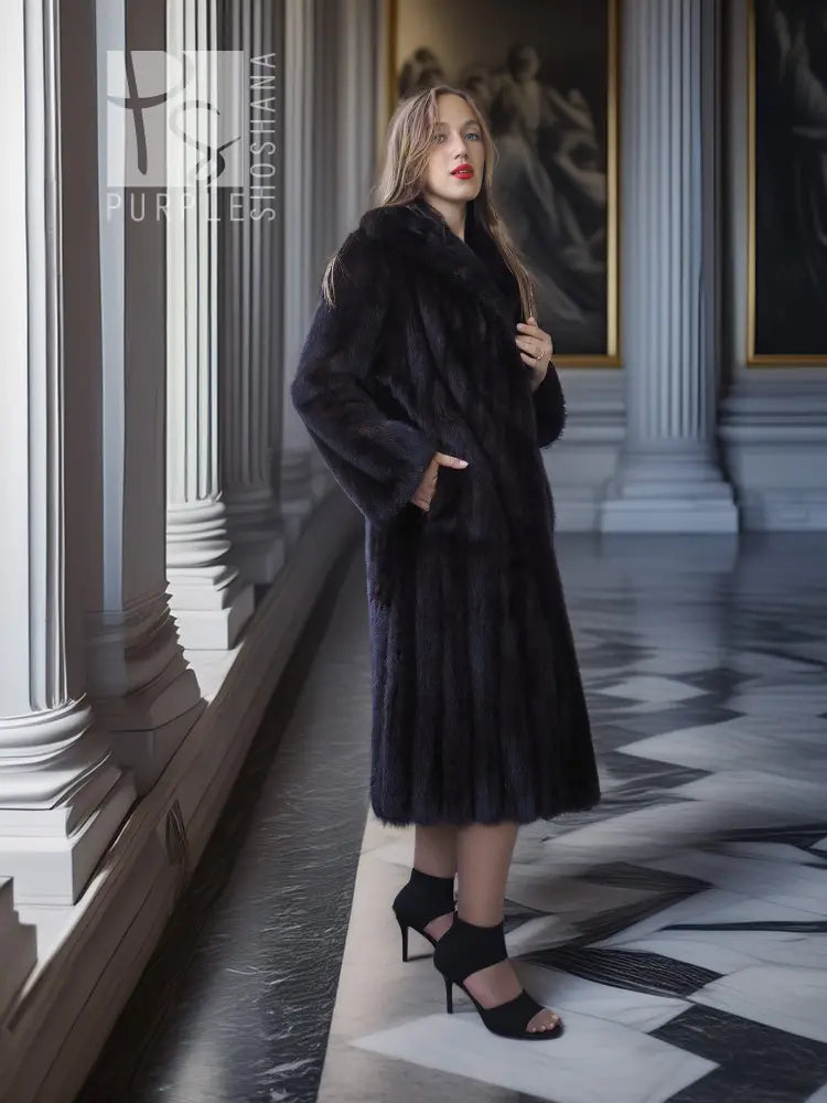 Black mink full-length coat with high collar, button front, and long sleeves.