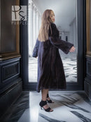 Full-length dark mink coat with open front and draped, oversized sleeves.