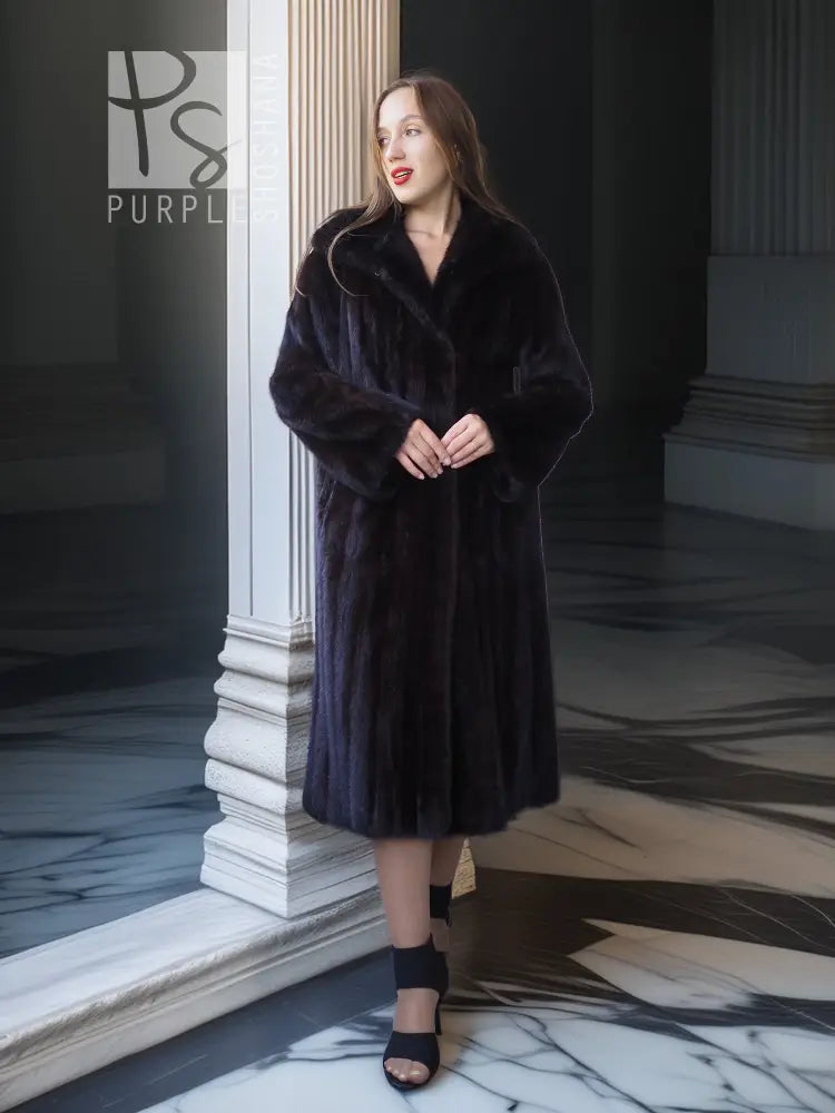 Black mink full-length coat with V-neck, straight skirt, and side-slit detailing.