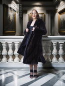 Black mink full-length coat with open front, long sleeves, and side slits