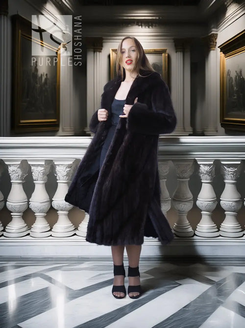 Black mink full-length coat with open front, long sleeves, and side slits