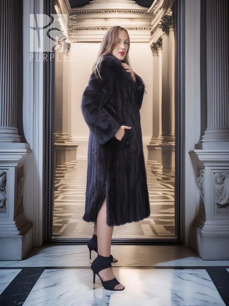 Black mink full-length coat with hooded collar and open front over the skirt hem.