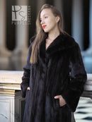 Black mink full-length coat with V-neck and plush fur texture, long sleeves.
