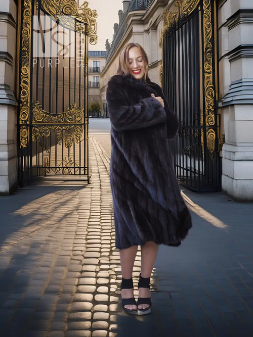 Full-length dark mink coat with plush fur texture and wide, flowing sleeves.