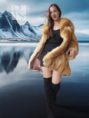 Tan shaggy fur hooded swing coat with open front and wide collar, worn over black dress