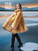 Tan shaggy fur swing coat with wide flare hem and hood, open front over black boots