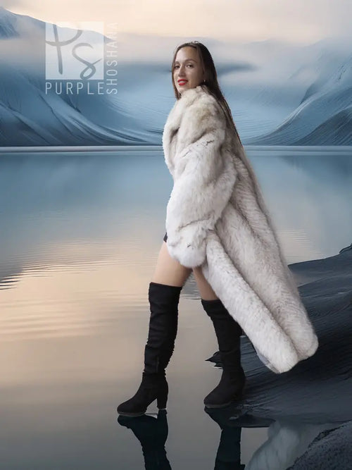 Cream faux-fur long coat with hood and long sleeves, side view with black boots