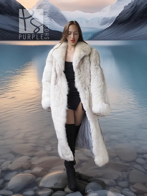 Cream faux-fur long coat with hood, open front and long sleeves over a black dress