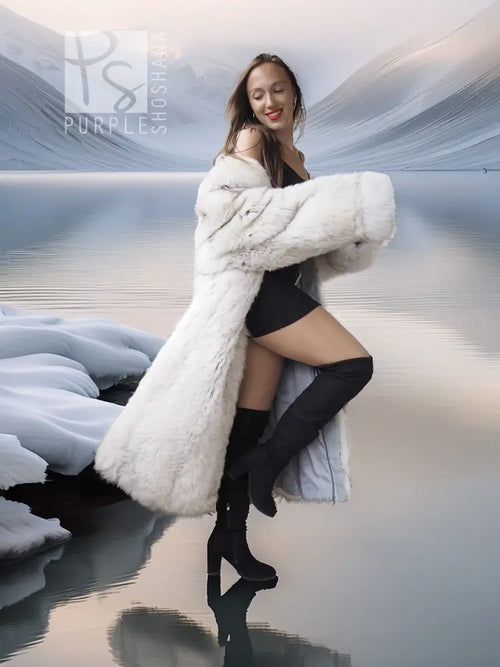 Light-colored fur coat with wide collar, worn over a black dress and knee boots