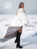Light-colored fur coat with wide collar, styled with a black dress and knee boots