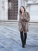 Taupe-brown mink fur jacket with chevron pattern, wide collar, buttonless front