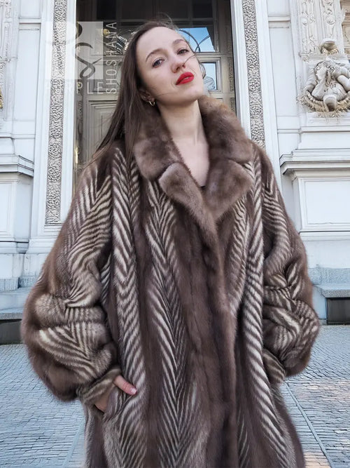 Brown mink jacket with herringbone pattern and thick fur collar detail