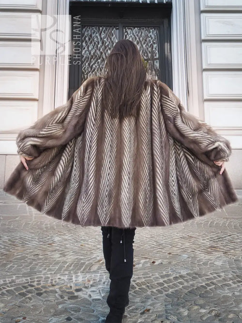 Back view of taupe-brown mink fur jacket with chevron herringbone pattern