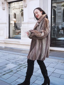 Mink fur jacket with chevron pattern and large collar, taupe-brown, arms crossed
