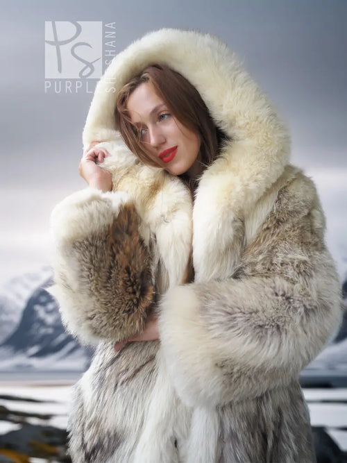 Coyote parka hood with plush cream and brown fur trim, close-up detail.