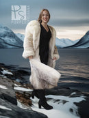 Full-length fur parka worn with black boots, fur hood and long side pockets.