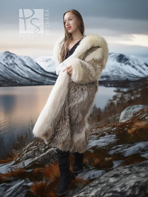 Full-length coyote parka with fur-lined hood and textured sleeves, angled outdoor view.