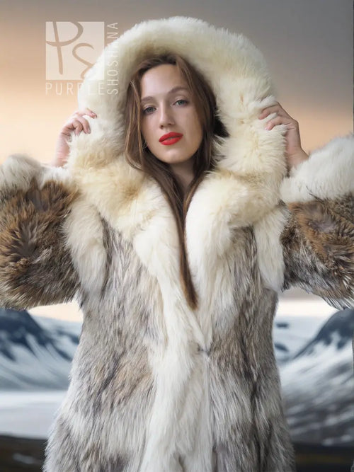 Full-length fur parka with dramatic hood, cream and taupe patterned fur sleeves.