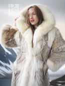 Full-length fur parka with hood framing face, cream hood fur and taupe fur panels.