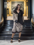 Stenciled mink coat with leopard pattern, black fur collar, belted waist, knee length