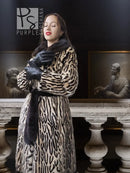 Stenciled mink coat with leopard pattern and black fur cuffs, belted waist