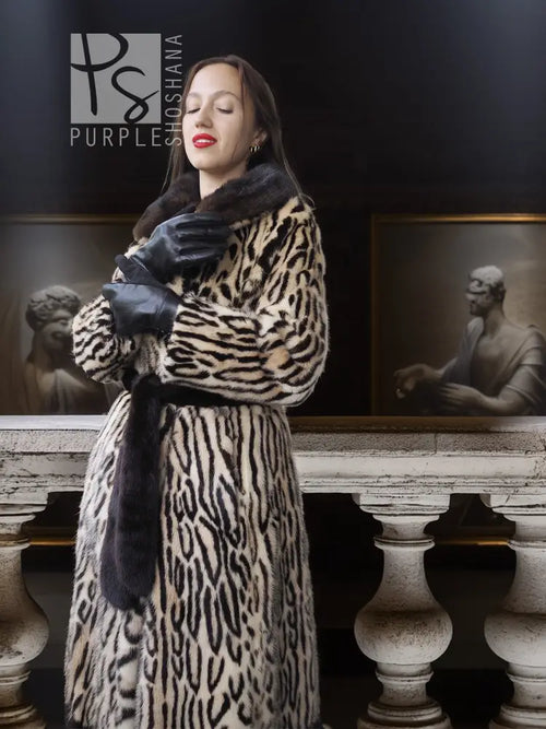 Stenciled mink coat with leopard pattern and black fur cuffs, belted waist