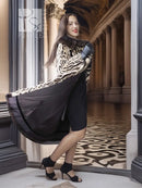 Stenciled mink coat with leopard pattern, black fur collar, draped side hem and belt