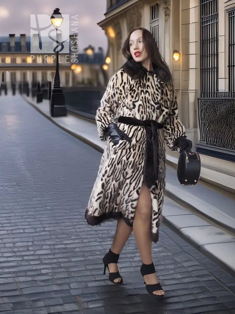 Stenciled mink coat with leopard pattern, side slit, belted waist and black cuffs
