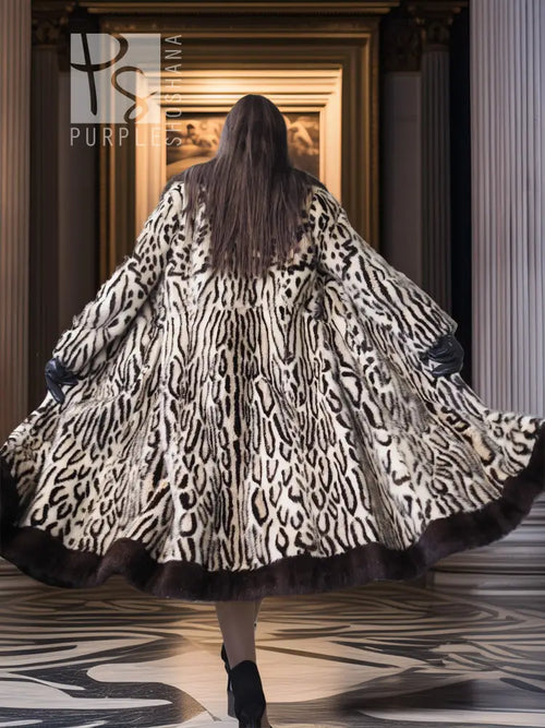 Stenciled mink coat with leopard pattern, wide flare sleeves, black fur trim, back view