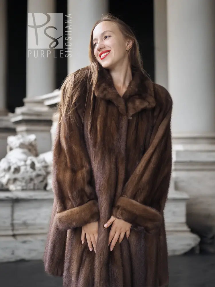 Dark brown mink swing coat with plush texture, raised collar, and long sleeves