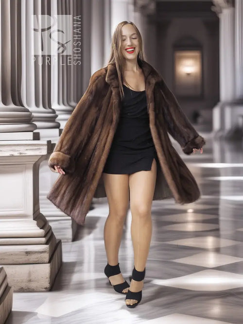 Tan-brown mink swing coat with folded-back cuffs, swing hem and wide collar.