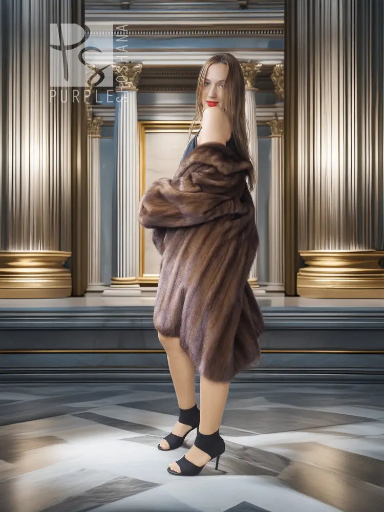 Brown mink swing coat with raised collar, flared hem, and voluminous sleeves