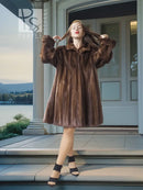 Brown mink swing coat with raised collar and short flared silhouette, wide sleeves