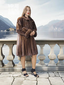 Dark brown mink swing coat with plush fur, wide collar, and short flared swing hem