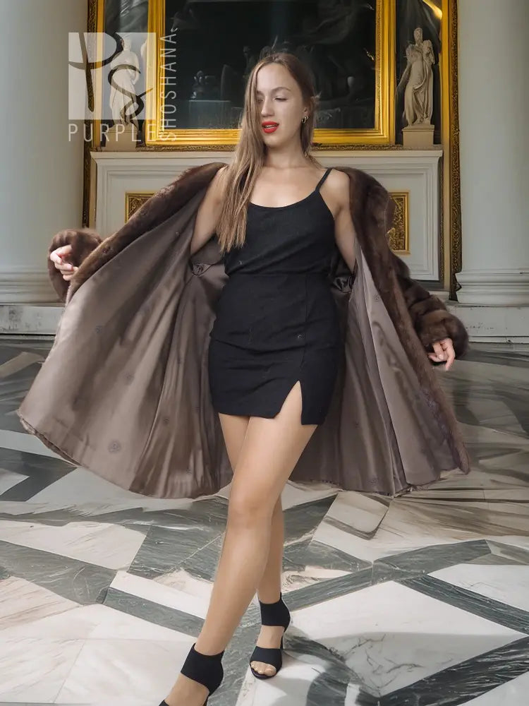 Dark brown mink swing coat with open front and draped sleeves, flared swing silhouette