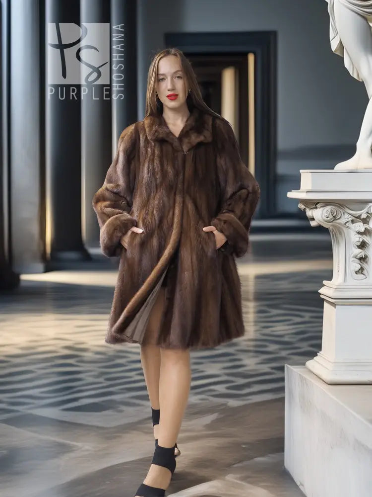 Brown mink swing coat with raised collar, relaxed open front, and long sleeves