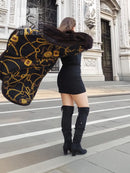 Mink swing coat with gold baroque lining, dark fur exterior, hooded neckline and swing hem