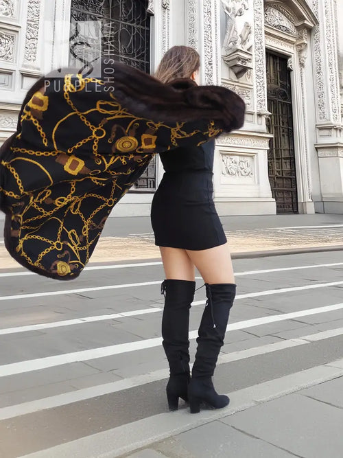 Mink swing coat with gold baroque lining, dark fur exterior, hooded neckline and swing hem