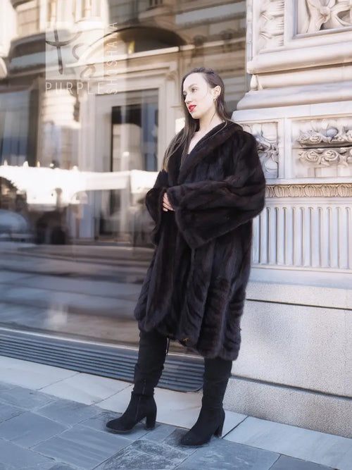 Dark brown mink swing coat with wide sleeves and draped silhouette