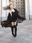 Dark brown mink swing coat with gold baroque patterned lining trim at hem