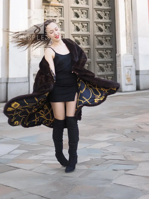 Dark brown mink swing coat with gold baroque patterned lining trim at hem