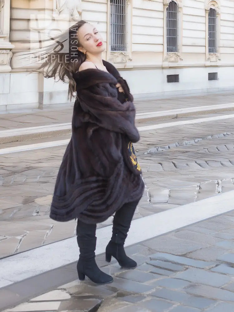 Dark brown mink swing coat with gold baroque trim along inner edge
